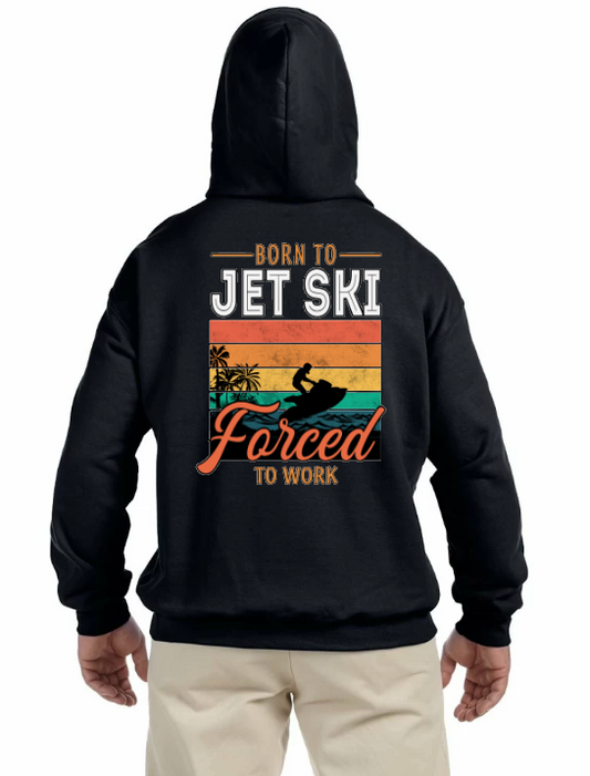 On the back of the Black Toronto Jet Ski Logo Hoodie, a vibrant square box showcases the phrase 'born to jet ski forced to work' in red, orange, yellow, and green, creating a dynamic backdrop. Within the box, a black silhouette of a man on a Sea-Doo adds an adventurous touch, embodying the spirit of watersport enthusiasts. This unique design captures the thrill and freedom of jet skiing, making a bold statement for those who love the open water.