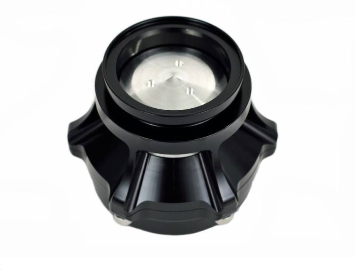 A back view of the Sea-Doo TiAL 50mm Blow-Off Valve Kit, revealing its durable construction and essential components. The high-quality TiAL 50mm blow-off valve is prominently displayed, designed to release excess pressure from the turbocharger system for enhanced performance. With all necessary hardware included, installation is straightforward, ensuring precise control and improved engine responsiveness.
