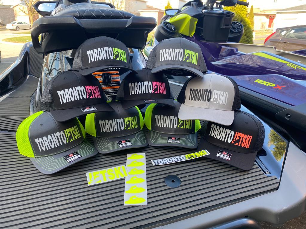 Toronto Jet Ski Snapback Trucker Hats, featuring a stylish design perfect for watersport enthusiasts. These hats combine urban flair with practicality, featuring the iconic 'Toronto Jet Ski' logo. The snapback closure ensures a comfortable and customizable fit, making them ideal for adventures on and off the water.