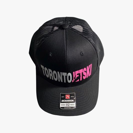 Toronto Jet Ski Snapback Trucker Hat in Black: This sleek black hat showcases the 'Toronto Jet Ski' logo embroidered in vibrant pink, adding a pop of color to its sophisticated design. The snapback closure ensures a comfortable fit for all-day wear, making it a stylish and practical accessory for your watersport adventures.
