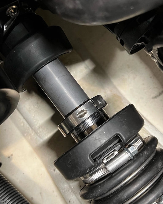 Bird's-eye view of the Sea-Doo Carbon Seal Reinforcement Clamp, showcasing its sturdy construction and precise design. The clamp is positioned to reinforce the carbon seal, highlighting its robust build and perfect fit. The high-quality materials and engineering ensure enhanced durability and reliable performance for Sea-Doo watercraft.