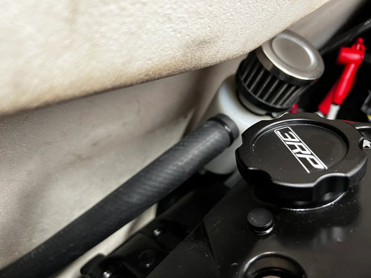 Sea-Doo Oil Catch Can Kit installed, demonstrating a perfect fit within the engine bay. The components are neatly arranged, showing the precision engineering and seamless integration with existing parts. The hoses and mounting hardware are securely fastened, highlighting the kit’s excellent compatibility and effectiveness in maintaining engine cleanliness.