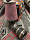 Sea-Doo Carbon Fiber Cold Air Intake with K&G Filter, a high-performance upgrade for Sea-Doo watercraft. This intake system features a lightweight carbon fiber construction and includes a K&G filter designed to maximize airflow and enhance engine performance. The combination improves throttle response and power output while offering a sleek, modern appearance.